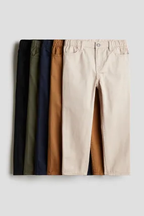 5-pack Relaxed Tapered Fit trousers - Regular waist - Long - Black/Navy blue/Brown - Kids | H&M GB